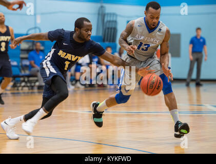 SAN ANTONIO (Nov. 04, 2017) - U.S. Navy Petty Officer 3rd Class Marquel  Delancey assigned to Atlantic Area CMD Center, attempts to score during a  basketball game. The 2017 Armed Forces Basketball