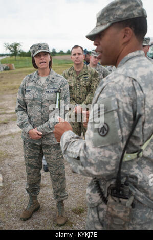 Army Capt. Charles Greene, commander of the U.S. Army’s 689th Rapid Port Opening Element, discusses cargo movement operations with Brig. Gen. Sarah Zabel, director of command, control, communications and Ccyber systems at U.S. Transportation Command, during Exercise Gateway Relief at MidAmerica St. Louis Airport in Mascoutah, Ill., on Aug. 7, 2013.  The exercise is designed to test the ability of the 689th and the Kentucky Air National Guard’s 123rd Contingency Response Group ability to stand up and operate a Joint Task Force-Port Opening, which receives relief supplies by airlift and stages t Stock Photo