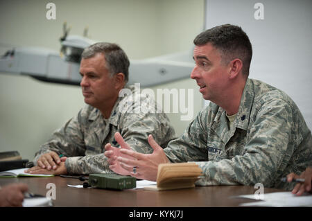 Lt. Col. Bruce Bancroft (right), director of the Joint Operations Center for Exercise Gateway Relief, and Col. Mark Heiniger, commander of the Kentucky Air National Guard’s 123rd Contingency Response Group, brief notional representatives from the Federal Emergency Management Agency at MidAmerica St. Louis Airport in Mascoutah, Ill., on Aug. 7, 2013. The 123rd is teaming up with the U.S. Army’s 689th Rapid Port Opening Element from Fort Eustis, Va., through Aug. 9, to execute the earthquake-response scenario, providing for the reception and distribution of disaster-relief supplies. (U.S. Air Na Stock Photo