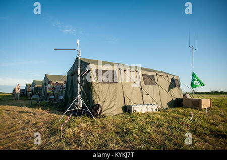 Four tents contain the majority of airfield operations for Exercise Gateway Relief at MidAmerica St. Louis Airport in Mascoutah, Ill., on Aug. 7, 2013. The Kentucky Air Guard’s 123rd Contingency Response Group is teaming up with the U.S. Army’s 689th Rapid Port Opening Element from Fort Eustis, Va., through Aug. 9 to operate a Joint Task Force-Port Opening in support of the exercise, an earthquake-relief scenario directed by U.S. Transportation Command. (U.S. Air National Guard photo by Maj. Dale Greer/Released) Stock Photo