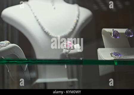 Elegant jewelry on sale in retail shop Stock Photo