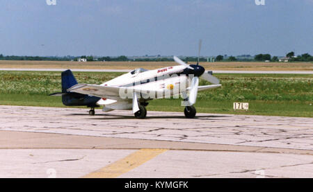 An image from the Daniels Collection featuring various North American P-51 Mustang aircraft, with a focus on air racing and military aviation history. The aircraft are powered by Packard Merlin engines and have notable registration numbers such as CF-MWC and N351DT. Stock Photo