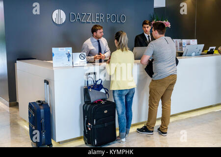 Buenos Aires Argentina,Palermo,Dazzler Polo,hotel,lobby,front-desk,clerk,adult adults man men male,woman women female lady,couple,guest,luggage,Hispan Stock Photo