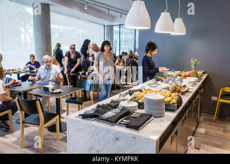 Buenos Aires Argentina,Palermo,Dazzler Polo,hotel,free breakfast buffet,dining room,counter,self-serve,tables,man men male,woman female women,plates,H Stock Photo
