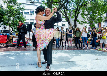 Buenos Aires Argentina,San Telmo Plaza Dorrego,tango dancers,senior seniors citizen citizens,Hispanic,man men male,woman female women,couple,dancing,a Stock Photo