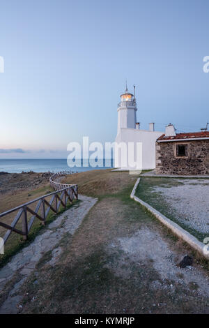 Sunset view of old white Inceburun lighthouse on the north coast of Sinop,Turkey. Stock Photo