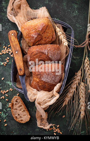 Fresh homemade buns on rustic background Stock Photo