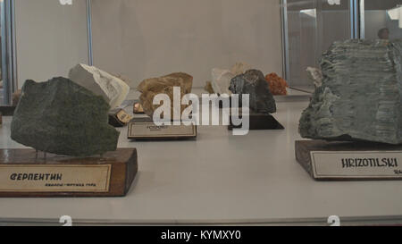 Various semi precious rocks displayed on exhibition with serbian tags Stock Photo