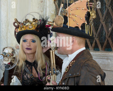 A couple of venetian masks during Carnival with red and gold disguise ...