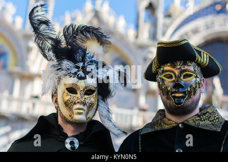 Venice, Italy, February 6, 2016 : couple in mask and costume at the carnival in Venice. The Carnival of Venice is an annual festival, world famous for Stock Photo