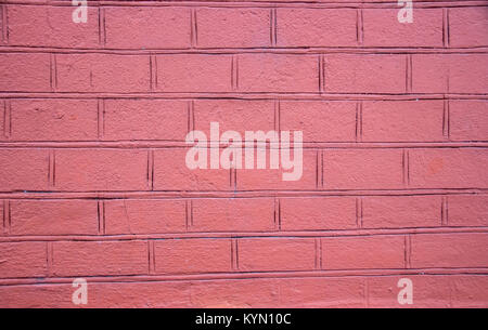 Plastered pink wall with painted bricks Stock Photo