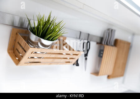 kitchen utensils and decor hanging on the white wall Stock Photo