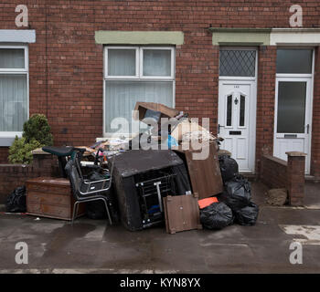 Furniture and other households goods damaged by flooding in Carlisle at the beginning of December, 2015. Record rain fall in Cumbria caused flooding to several areas of Carlisle, causing houses to be evacuated by emergency services. Stock Photo