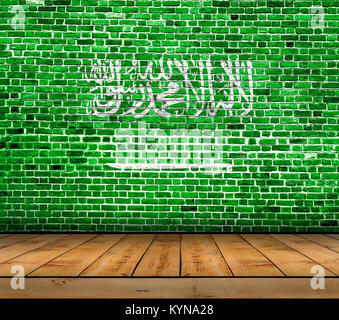 Saudi Arabia flag painted on brick wall with wooden floor Stock Photo