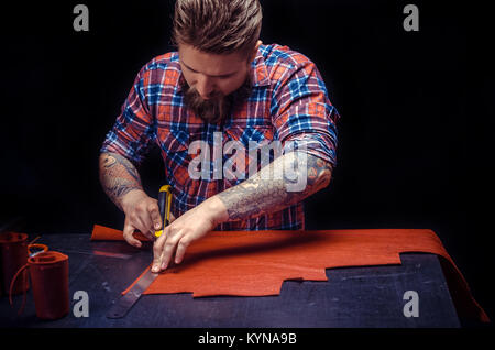 Worker of leather making quality products Stock Photo