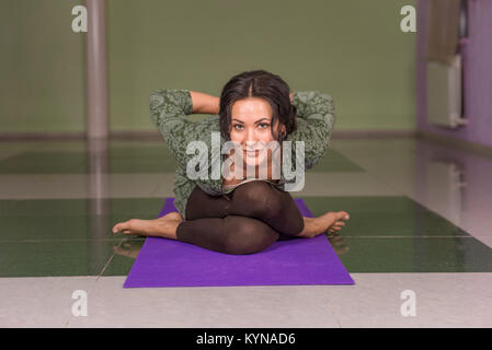 Yoga female presents yoga poses Stock Photo - Alamy