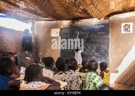 Ongoing french lesson in an elementary classroom in a township of Ouagadougou, Burkina Faso. March 4, 2008. Stock Photo