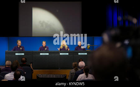 One of the final images of Saturn's moon Titan, that was taken by the Cassini spacecraft on Sept. 11, is seen as Cassini project scientist at JPL, Linda Spilker, second from right, speaks during a press conference previewing Cassini's End of Mission, Wednesday, Sept. 13, 2017 at NASA's Jet Propulsion Laboratory in Pasadena, California. Also participating in the press conference were director of NASA's Planetary Science Division, Jim Green, left, Cassini program manager at JPL, Earl Maize, second from left, and principle investigator for the Neutral Mass Spectrometer (INMS) at the Southwest Res Stock Photo