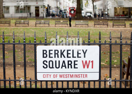 Berkeley Square sign on railings with square behind Stock Photo