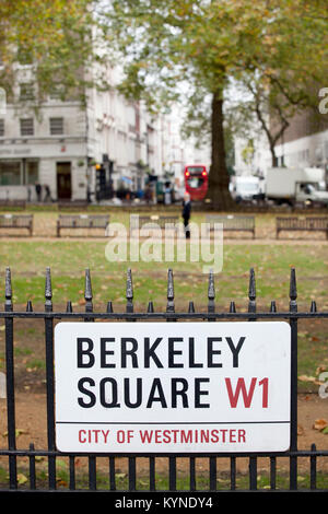 Berkeley Square sign on railings with square behind Stock Photo