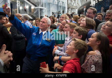 Vice President Mike Pence takes a group selfie with kids that were in attendance during an event where NASA introduced 12 new astronaut candidates, Wednesday, June 7, 2017 at NASA’s Johnson Space Center in Houston, Texas. After completing two years of training, the new astronaut candidates could be assigned to missions performing research on the International Space Station, launching from American soil on spacecraft built by commercial companies, and launching on deep space missions on NASA’s new Orion spacecraft and Space Launch System rocket. Photo Credit: (NASA/Bill Ingalls) Stock Photo