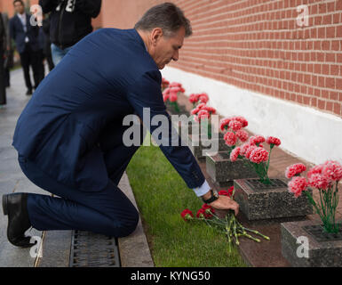 Expedition 52 flight engineer Paolo Nespoli of ESA lays roses at the site where Russian space icons are interred as part of traditional pre-launch ceremonies, Monday, July 10, 2017 in Moscow. Photo Credit: (NASA/Bill Ingalls) Stock Photo