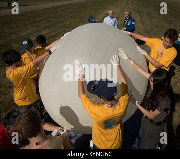 NASA Acting Chief Technologist Douglas Terrier, background left, and Greg “Box” Johnson, executive director of Center for the Advancement of Science in Space (CASIS) and former astronaut, background right, watch as attendees of the Boy Scouts of America National Jamboree prepare to launch a weather balloon, Tuesday, July 25, 2017 at the Summit Bechtel Reserve in Glen Jean, West Virginia. Photo Credit: (NASA/Bill Ingalls) Stock Photo