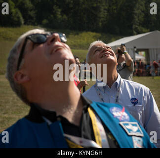 Greg “Box” Johnson, executive director of Center for the Advancement of Science in Space (CASIS) and former astronaut, foreground, and NASA Acting Chief Technologist Douglas Terrier watch as attendees of the Boy Scouts of America National Jamboree launch a weather balloon, Tuesday, July 25, 2017 at the Summit Bechtel Reserve in Glen Jean, West Virginia. Photo Credit: (NASA/Bill Ingalls) Stock Photo