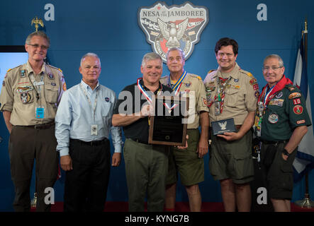 Greg “Box” Johnson, executive director of Center for the Advancement of Science in Space (CASIS) and former astronaut, third from left, receives an Distinguished Eagle Scout Award from Director of Strategic Initiatives, National Foundation, Boy Scouts of America Drew Glassford, left, NASA Acting Chief Technologist Douglas Terrier, Assistant Chief Scout Executive Don McChesney, National Eagle Scout (NESA) Committee member Todd Plotner, and Physician Brad Epstein, right, during the Boy Scouts of America National Jamboree, Tuesday, July 25, 2017 at the Summit Bechtel Reserve in Glen Jean, West Vi Stock Photo