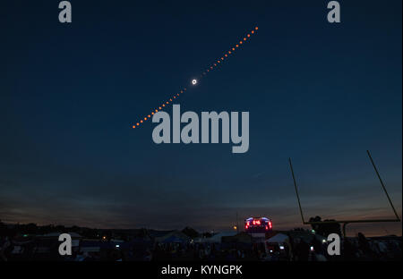 This composite image shows the phases of a total solar eclipse as it progressed over Madras, Oregon, on August 21, 2017. The eclipse was visible across a narrow strip of the U.S., with partial views in other parts of North and South America, Africa, and Europe. NASA provided the photo. Stock Photo