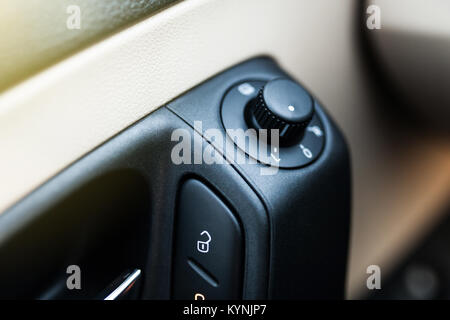 Mirror control buttons in a car Stock Photo