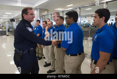 Explorers attending the National Law Enforcement Exploring Leadership Academy are given a tour of U.S. Customs and Border Protection, Office of Field Operations, activities at Dulles International Airport in Dulles, Va., July 25, 2017. U.S. Customs and Border Protection photo by Glenn Fawcett Stock Photo