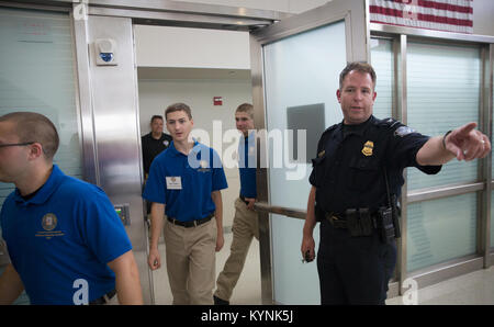 Explorers attending the National Law Enforcement Exploring Leadership Academy are given a tour of U.S. Customs and Border Protection, Office of Field Operations, activities at Dulles International Airport in Dulles, Va., July 25, 2017. U.S. Customs and Border Protection photo by Glenn Fawcett Stock Photo