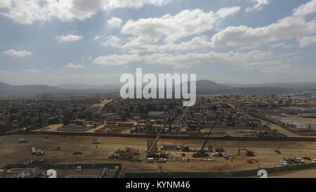 An aerial view of a work site being set up near the Otay Mesa Port of Entry outside of San Diego, California, shows crews laying the groundwork for construction of prototypes of the proposed border wall between the United States and Mexico October 3, 2017. U.S. Customs and Border Protection Photo Stock Photo