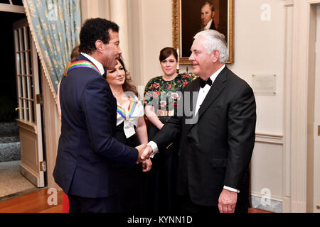 U.S. Secretary of State Rex Tillerson chats with Kennedy Center Honoree Lionel Ritchie at the Kennedy Center Honors Dinner at the U.S. Department of State in Washington, D.C. on December 2, 2017. Stock Photo