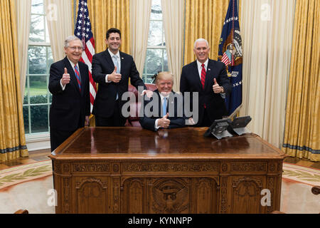 President Donald J. Trump celebrates the passage of the Tax Cuts Act with Vice President Mike Pence, Senate Majority Leader Mitch McConnell, and Speaker of the House Paul Ryan | December 20, 2017 (Official White House Photo by Joyce N. Boghosian) Photo of the Day December 21, 2017 24342246127 o Stock Photo