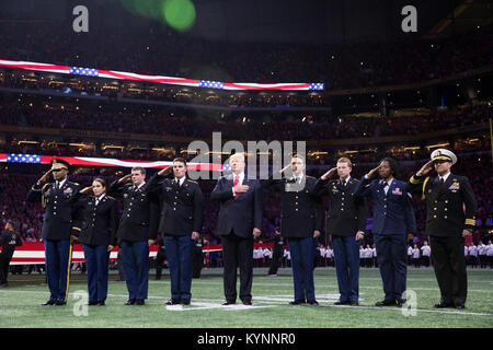 President Donald J. Trump participates in on field ceremonies at the 2018 College Football Playoff National Championship between the University of Alabama Crimson Tide and the University of Georgia Bulldogs | January 8, 2018 (Official White House Photo by Shealah Craighead) Photo of the Day January 9, 2018 24733579187 o Stock Photo