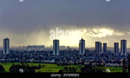 Glasgow, Scotland, UK 15th January.UK Weather: Dark and stormy with rain and sleet om the city as the polar storm comes from the west over the Scotstoun towers and into south Glasgow. Credit Gerard Ferry/Alamy news Stock Photo