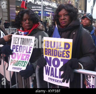 New York City, New York, USA. 15th Jan, 2018. Protesters at the 'Rally Against Racism: Stand Up for Haiti and Africa' held on Martin Luther King's Birthday in Times Square. Credit: Nancy Kaszerman/ZUMA Wire/Alamy Live News Stock Photo