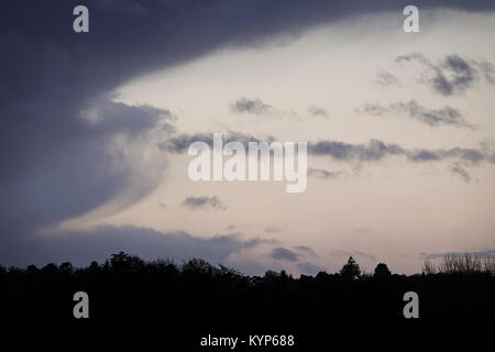 Tuesley Farm, Godalming. 16th January 2018. Cold and stormy conditions this morning as an area of low pressure swept in from the west. Sunrise over Tuesley Farm in Godalming, Surrey. Credit: james jagger/Alamy Live News Stock Photo