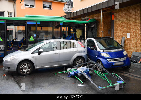 Eberbach, Germany. 16th Jan, 2018. Police, fire department and emergency service forces secure an accident site in Eberbach, Germany, 16 January 2018. A school bus crashed into a wall, injuring several passangers. Credit: Uwe Anspach/dpa/Alamy Live News Stock Photo