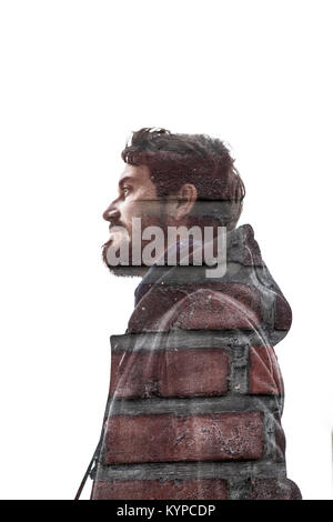 double exposure of the silouette of a man and a brick wall Stock Photo