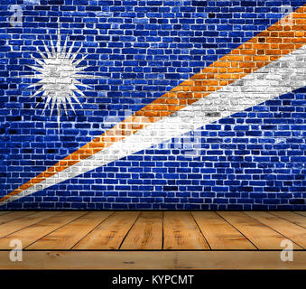 Marshall Islands flag painted on brick wall with wooden floor Stock Photo