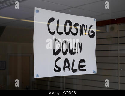 “Closing Down Sale”, Sign in Window of closed down retail business in deserted shopping precinct, Crossways Shopping Centre, Paignton,   Devon, UK Stock Photo