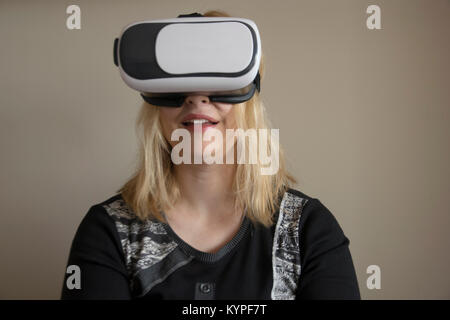 Woman using VR headset Stock Photo
