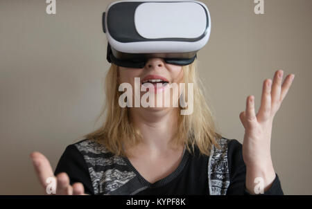 Woman using VR headset Stock Photo