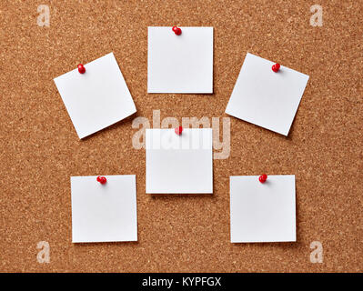 close up of note papers with pushpins on a corkboard Stock Photo