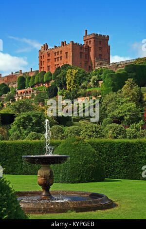 Powis Castle near Welshpool in Powis mid Wales seen from the splendid gardens with blue skies behind Stock Photo