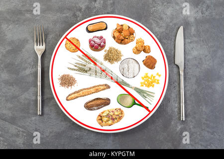 prepared food plate for people allergic to gluten on grey slate background, red line through plate , prohibition sign Stock Photo