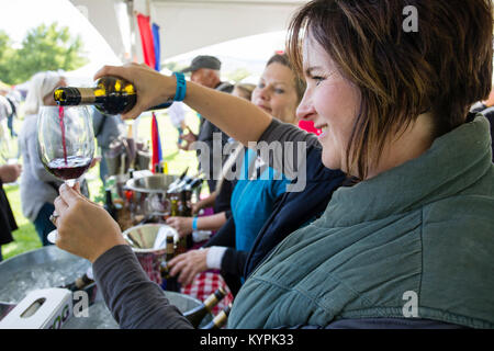 Visting attendees tasting the various wines that are on display at the annual Festival of the Grape located in Oliver, British Columbia, Canada. Stock Photo